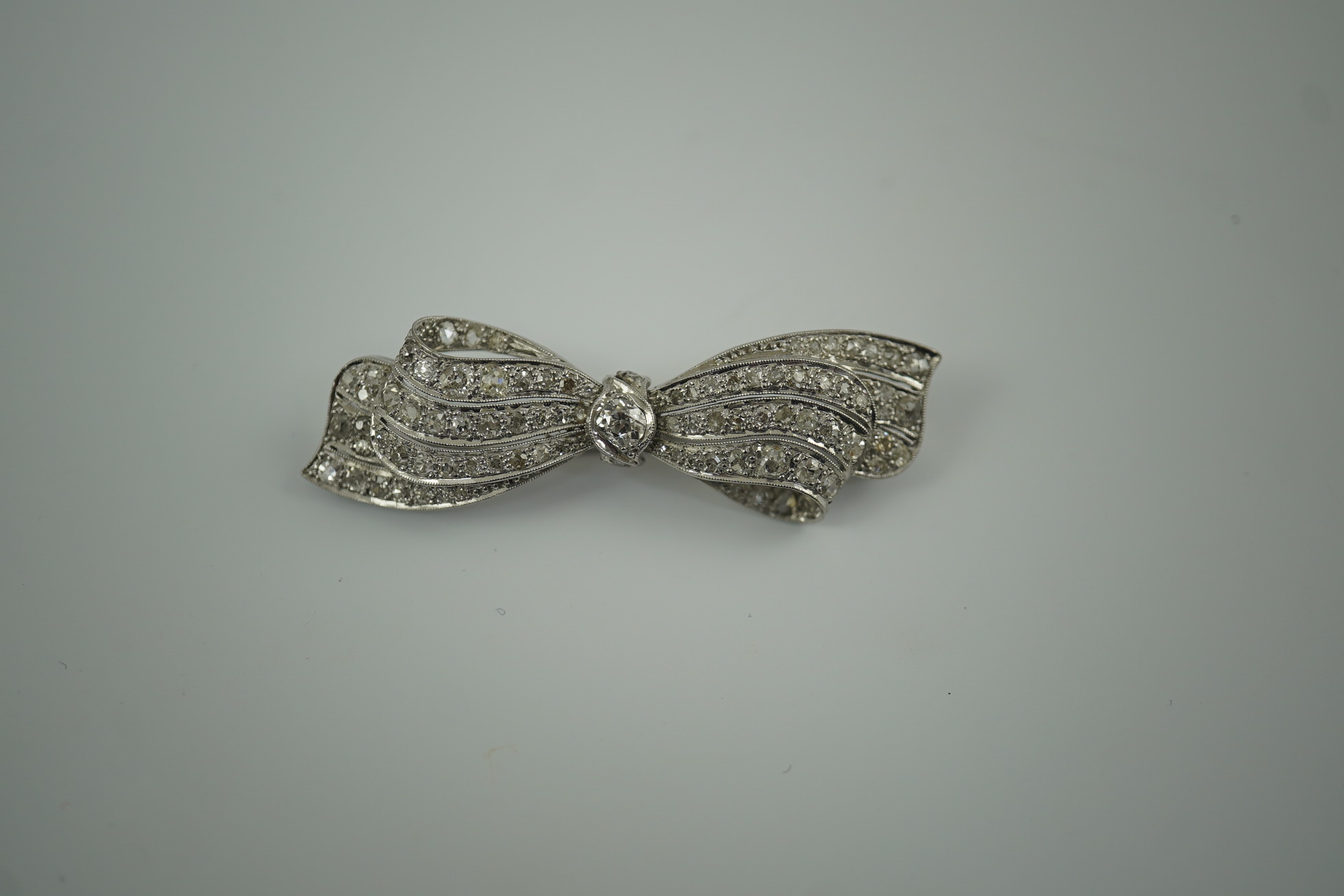 A 1940's platinum? and diamond cluster set ribbon bow brooch